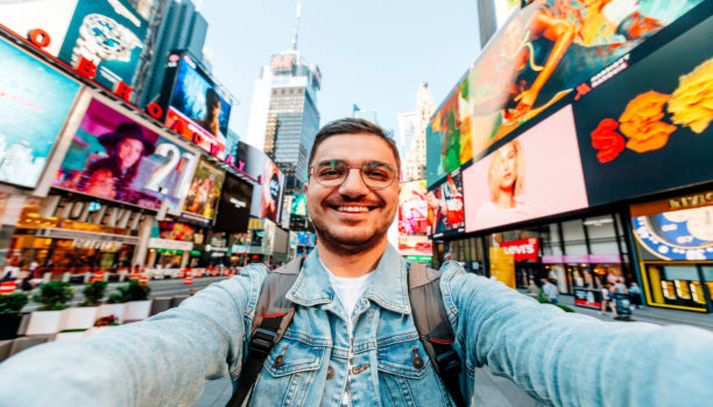 https://media.gettyimages.com/id/2201334744/photo/happy-smiling-man-taking-selfie-on-times-square-on-a-sunny-day-new-york-city-usa.jpg?s=612x612&w=0&k=20&c=NBfMMHG-G7RVQK5ShEGYmHtLupnNwXjF-3G63HtvcGE=