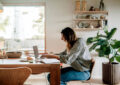 https://media.gettyimages.com/id/2190548751/photo/side-view-of-focused-businesswoman-working-on-laptop-while-sitting-near-dining-table-in.jpg?s=612x612&w=0&k=20&c=udwqsHgg7iT4iHeW8LS9wa8oZTOGtXc8cg_wxY-tLZ4=