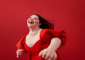 https://media.gettyimages.com/id/1368366693/photo/young-woman-laughing-against-red-background.jpg?s=612x612&w=0&k=20&c=g_fl6JvTmcbe9BdjSqjDYXNP-3RaOsJvpnT5eFHKCd0=