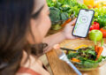 https://media.gettyimages.com/id/2193492251/photo/woman-tracking-her-diet-with-phone-while-enjoying-healthy-salad.jpg?s=612x612&w=0&k=20&c=u29qopBCkNSJoSXTYwhIOz1QRnq9BtmaDSvf90lfI98=