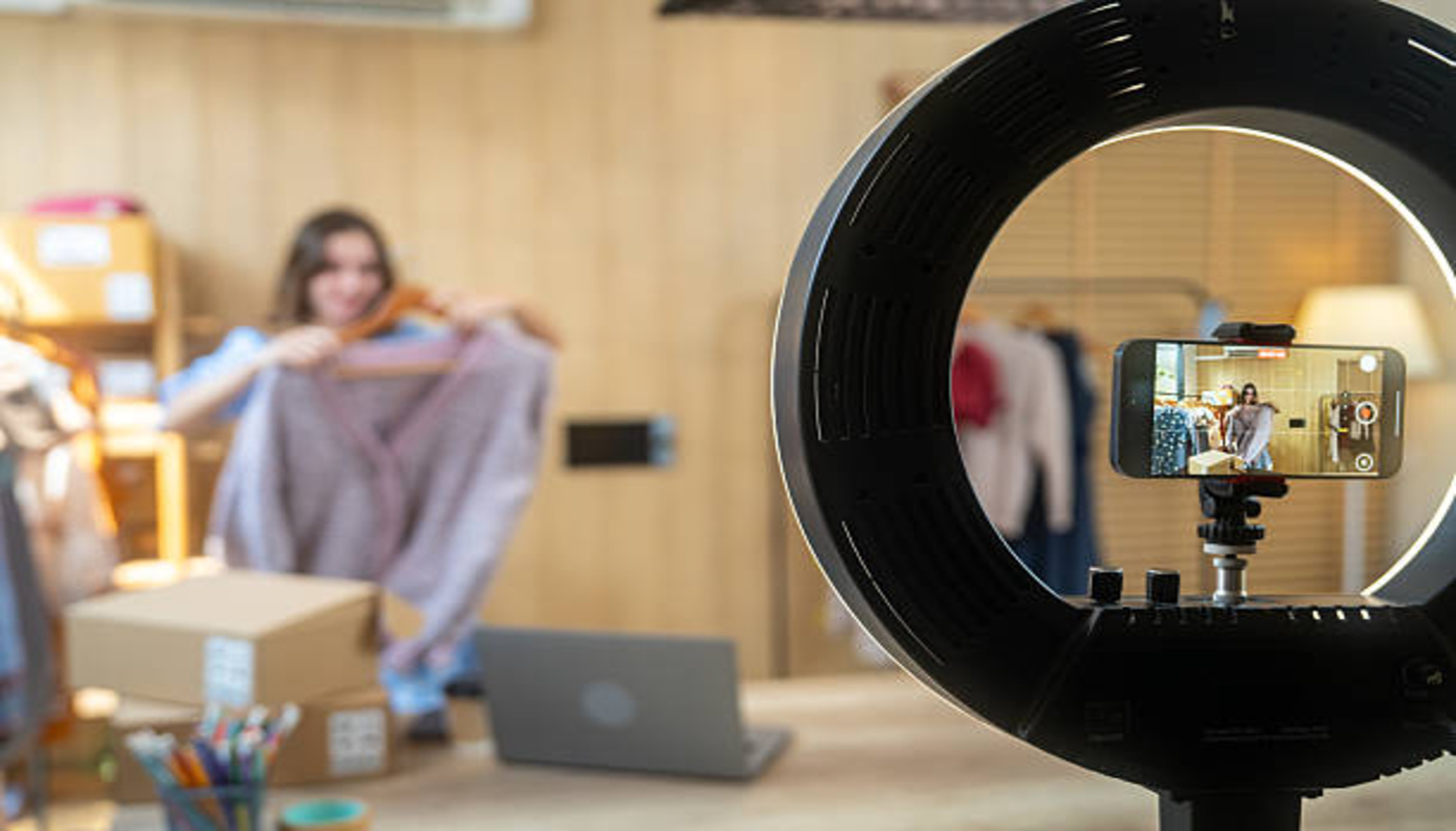 https://media.gettyimages.com/id/2225692914/photo/young-woman-streaming-live-from-her-store-presenting-clothes-selling-online.jpg?s=612x612&w=0&k=20&c=z_wpddrTp1c135f8TP_EDRmKgs1yr7WIBO9w0wok2uM=
