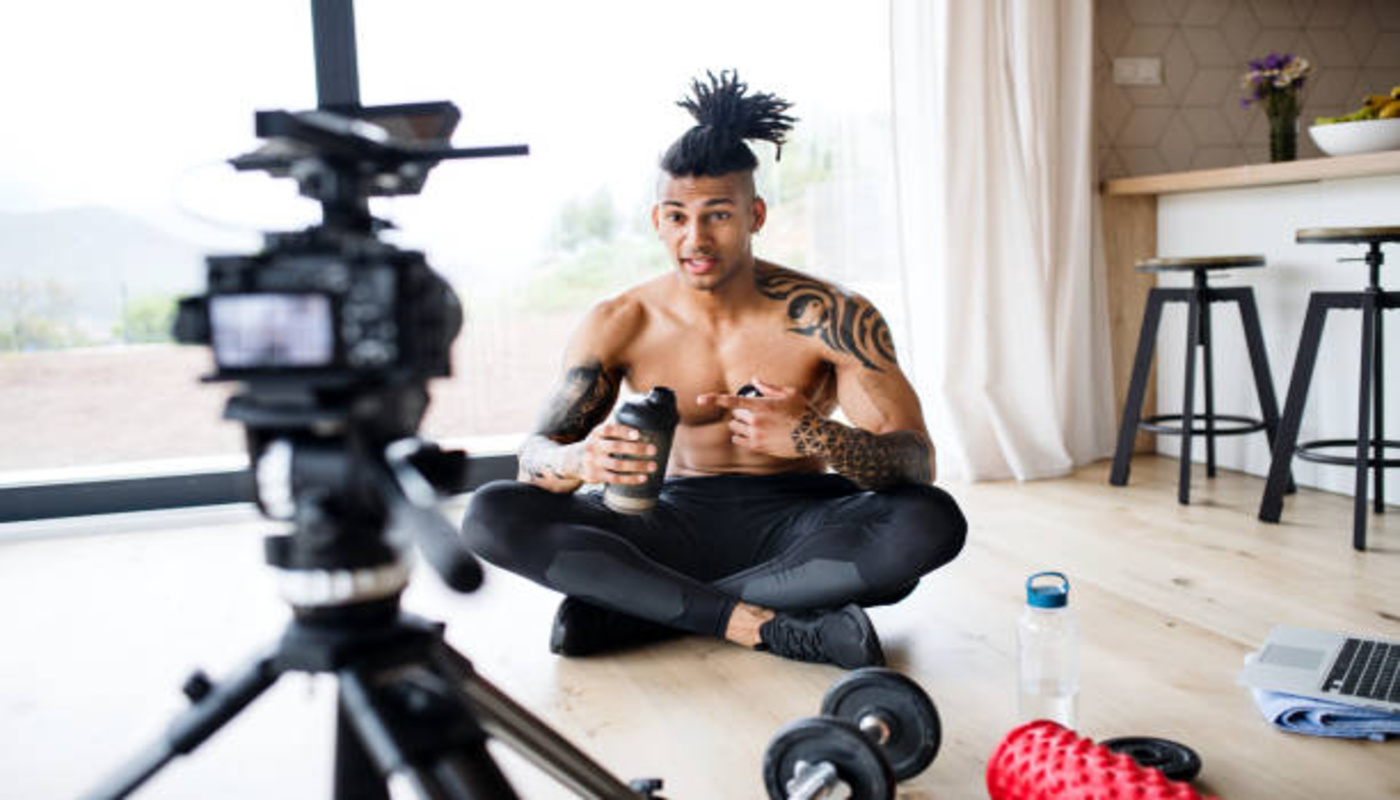 https://media.gettyimages.com/id/1160224474/photo/fitness-vlogger-making-a-video-of-himself-at-home-talking-to-camera.jpg?s=612x612&w=0&k=20&c=9nlyDizrR8nsY3yVOmJO9EOJtaPAZs9PCvyYI1b9ryo=