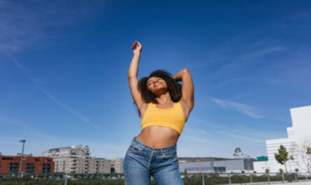 https://media.gettyimages.com/id/1217811326/photo/smiling-young-woman-dancing-with-eyes-closed.jpg?s=612x612&w=0&k=20&c=naYkyxnwhvj_vQWdfHXTdwaot2GbmmG7Nshfx7hnuUU=