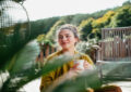 https://media.gettyimages.com/id/2197419739/photo/woman-with-morning-cup-of-coffee-sitting-on-patio-and-enjoying-moment-for-herself-portrait-of.jpg?s=612x612&w=0&k=20&c=qNMO9T4X2NNbUBvUhlNp5cqJXkWsf7WhPI9FA4fz0U4=