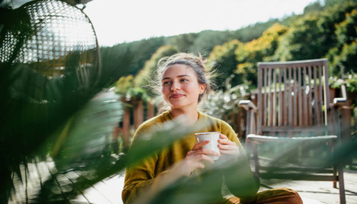 https://media.gettyimages.com/id/2197419739/photo/woman-with-morning-cup-of-coffee-sitting-on-patio-and-enjoying-moment-for-herself-portrait-of.jpg?s=612x612&w=0&k=20&c=qNMO9T4X2NNbUBvUhlNp5cqJXkWsf7WhPI9FA4fz0U4=