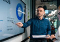 https://media.gettyimages.com/id/2264553072/photo/business-people-discussing-work-in-modern-office-or-co-working-space.jpg?s=612x612&w=0&k=20&c=KyxwInISqK1OQGWIE0hPC8wnP8Ri880TJkHrmO6d2jA=