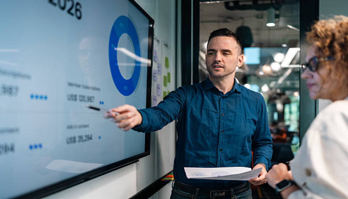 https://media.gettyimages.com/id/2264553072/photo/business-people-discussing-work-in-modern-office-or-co-working-space.jpg?s=612x612&w=0&k=20&c=KyxwInISqK1OQGWIE0hPC8wnP8Ri880TJkHrmO6d2jA=