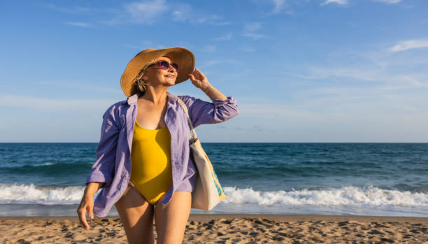 https://media.gettyimages.com/id/2195538068/photo/senior-woman-enjoying-summer-vacation-on-the-beach.jpg?s=612x612&w=0&k=20&c=cCogsFjC7hMi-9oyeY3l3drfkBr5PT1rsu1tjmrtrws=