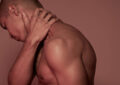 https://media.gettyimages.com/id/962580722/photo/young-man-having-neck-pain.jpg?s=612x612&w=0&k=20&c=3R9QWMGdk7y6kmY6tVL2GfPJaJ9n2m5oh335vFgs-Bc=