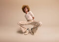 https://media.gettyimages.com/id/2214006947/photo/young-man-crouching-against-beige-background.jpg?s=612x612&w=0&k=20&c=O61lpwPjRuFKKZbqIMm8HDB2-ByDG6tNgZw92iQfGOc=