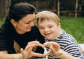 https://media.gettyimages.com/id/2230443095/photo/mother-and-son-with-down-syndrome-making-heart-shape-with-hands.jpg?s=612x612&w=0&k=20&c=BxxnFxGbbdUqpDfuWCipvkWx99EdZdAnYTjV6rH2Vkc=