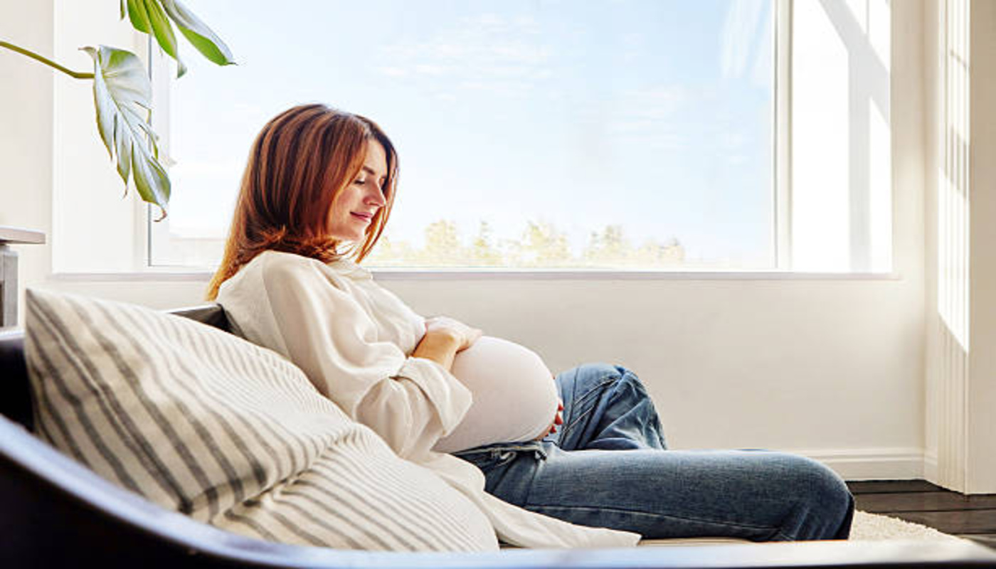 https://media.gettyimages.com/id/2238016743/photo/pregnant-woman-relaxing-on-sofa-near-window-at-home.jpg?s=612x612&w=0&k=20&c=CBhQXq1ah8fjxSRvqWsWl0ZSNop0FvHXDsSg2RgZo9A=