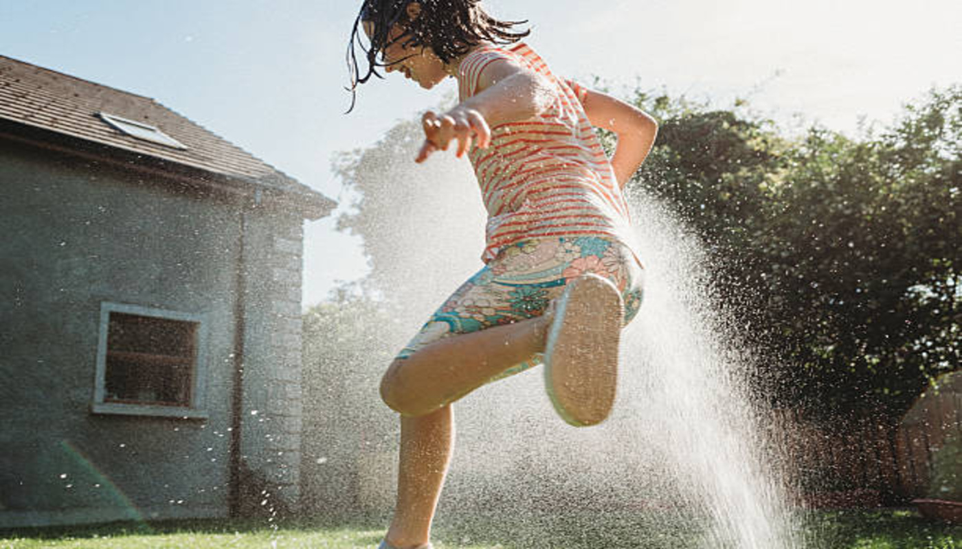 https://media.gettyimages.com/id/2224676887/photo/a-carefree-little-girl-enjoys-a-moment-of-refreshment-running-through-a-sprinkler-in-a-garden.jpg?s=612x612&w=0&k=20&c=C3NjsB02V9IpwyYhP9XRk8gc1vgHztZRGe3X5Pzf-ys=