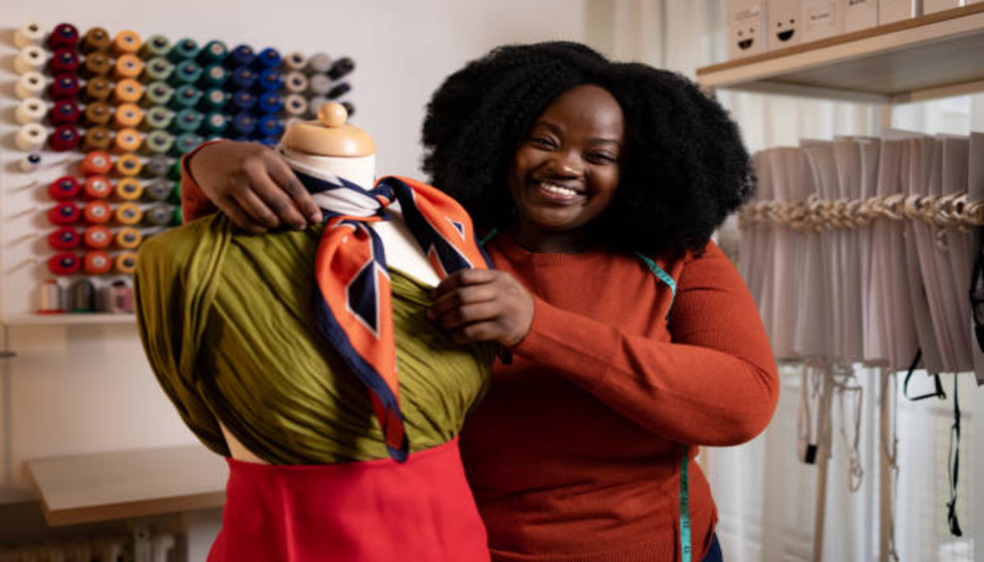 https://media.gettyimages.com/id/1451322649/photo/happy-african-american-female-tailor-working-on-mannequin-in-clothing-studio.jpg?s=612x612&w=0&k=20&c=GjdkiPZD7BMlMzObGGiXGwWZ-1TPKPyQ7CGQ_1J-Omc=