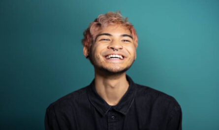 https://media.gettyimages.com/id/1363870324/photo/cheerful-young-man-smiling-on-blue-background.jpg?s=612x612&w=0&k=20&c=Poiwzk5TQmv6p2OEbCBJEFQUHyuF7F4ec05fRtaYWrE=