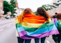 https://media.gettyimages.com/id/2274443493/photo/two-young-women-wrapped-in-a-rainbow-pride-flag-walking-on-a-city-street.jpg?s=612x612&w=0&k=20&c=GXYn7SzyrD0g6PDBaZucJKB6SgJEHbhSmPbs_2802jA=
